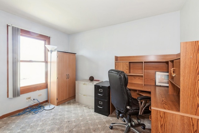 office with light colored carpet and baseboards