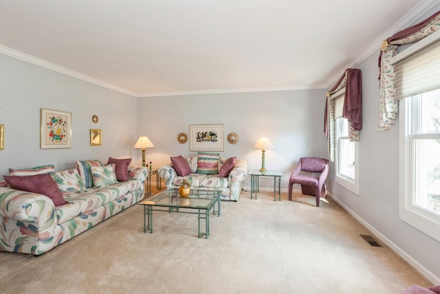 living area with baseboards, ornamental molding, and carpet