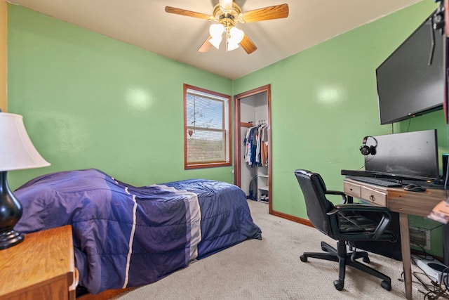carpeted bedroom featuring a ceiling fan, baseboards, and a closet