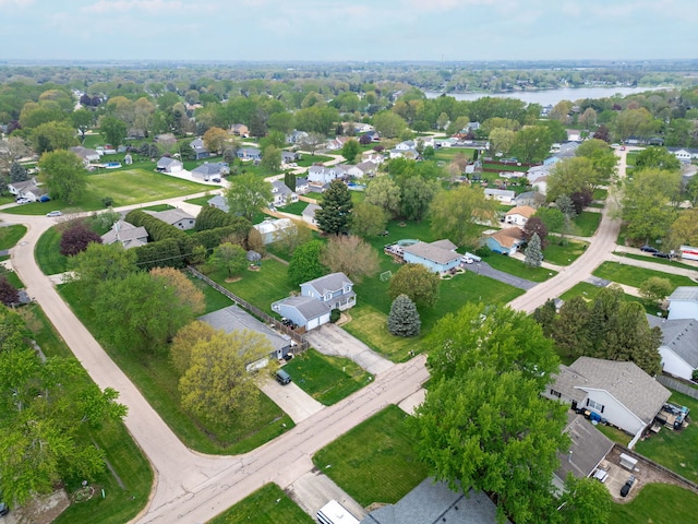 drone / aerial view featuring a water view and a residential view