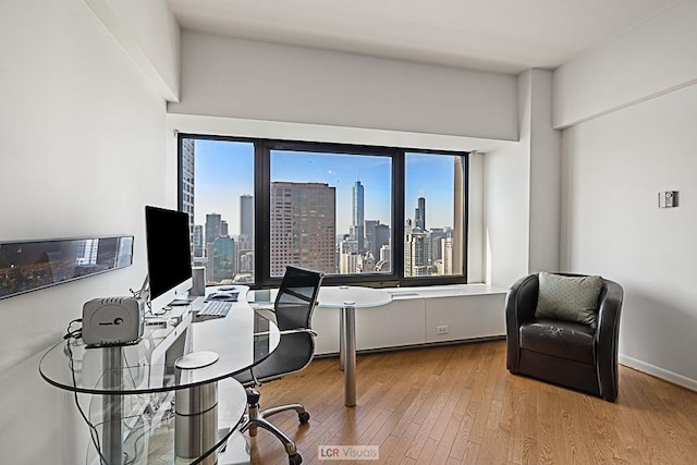 175 E Delaware Pl Unit 5019, Chicago, IL 60611 - home office featuring wood finished floors
