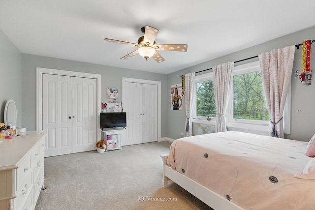 12652 Suffield Dr, Palos Park, IL 60464 - bedroom featuring light colored carpet, baseboards, ceiling fan, and two closets