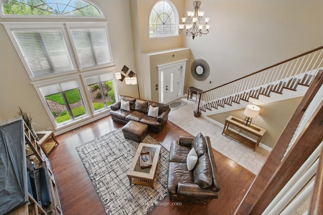 12652 Suffield Dr, Palos Park, IL 60464 - living area with an inviting chandelier, plenty of natural light, stairs, and a towering ceiling