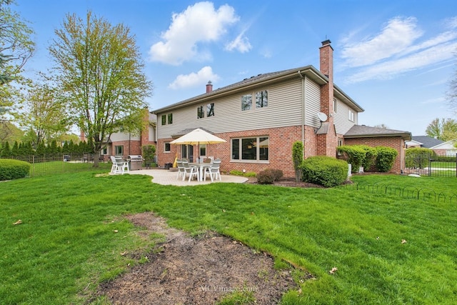 12652 Suffield Dr, Palos Park, IL 60464 - rear view of property with fence, brick siding, a chimney, a lawn, and a patio