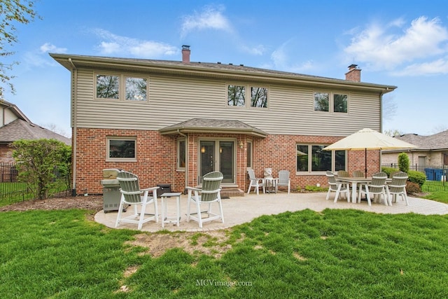 12652 Suffield Dr, Palos Park, IL 60464 - rear view of property featuring fence, a chimney, a lawn, and brick siding