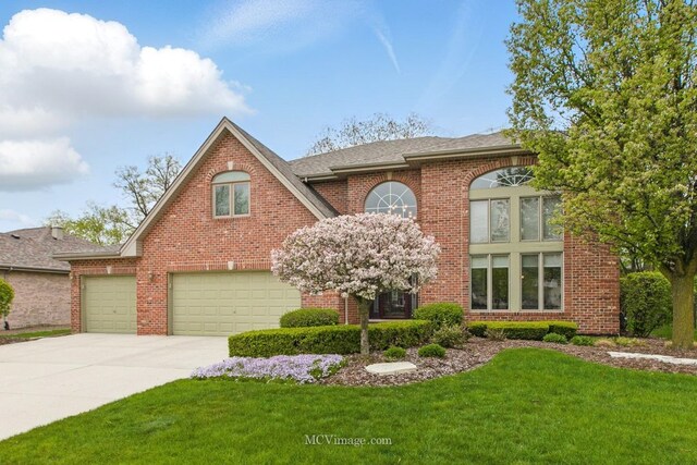 12652 Suffield Dr, Palos Park, IL 60464 - traditional home with a shingled roof, concrete driveway, a front lawn, and brick siding