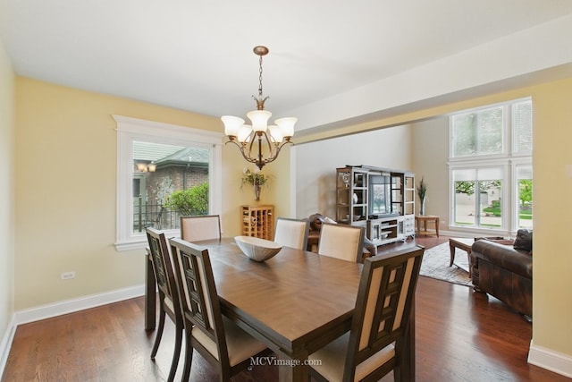12652 Suffield Dr, Palos Park, IL 60464 - dining space with baseboards, a notable chandelier, a wealth of natural light, and dark wood finished floors