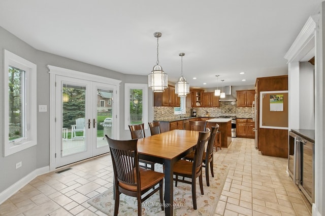 12652 Suffield Dr, Palos Park, IL 60464 - dining area with french doors, visible vents, baseboards, wine cooler, and recessed lighting