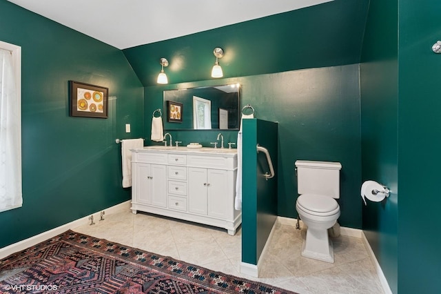 317 Augusta Ave, Dekalb, IL 60115 - bathroom featuring a sink, tile patterned flooring, toilet, and baseboards