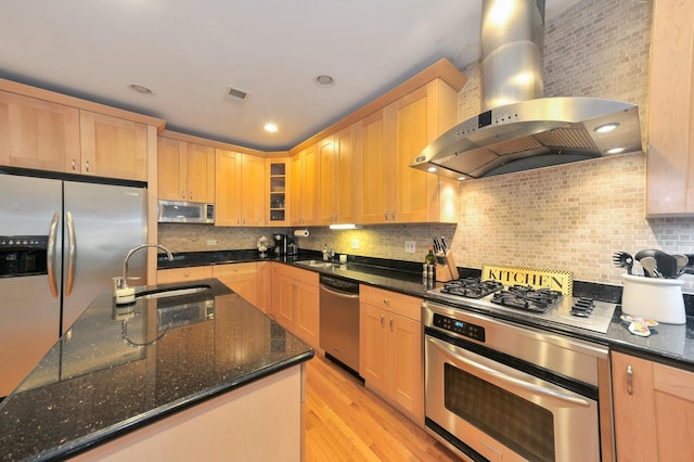 1521 N Ashland Ave Unit 2, Chicago, IL 60622 - kitchen with stainless steel appliances, wall chimney range hood, a sink, light wood-type flooring, and glass insert cabinets