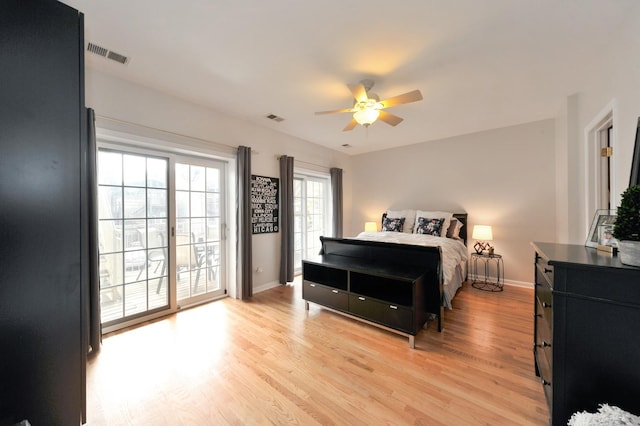 1521 N Ashland Ave Unit 2, Chicago, IL 60622 - bedroom with freestanding refrigerator, access to outside, light wood-style floors, and baseboards
