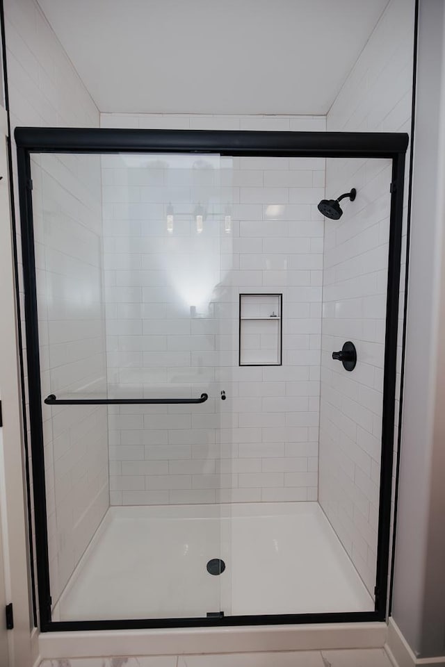 bathroom with a stall shower