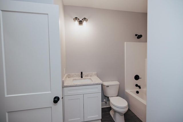 bathroom featuring vanity, shower / bath combination, toilet, and wood finished floors