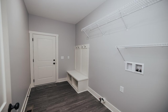 washroom featuring washer hookup, baseboards, laundry area, and dark wood finished floors