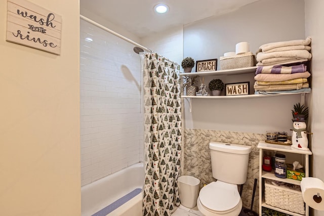 full bathroom with recessed lighting, shower / bath combination with curtain, toilet, and tile walls