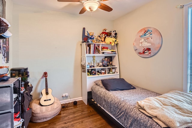 bedroom with ceiling fan and wood finished floors