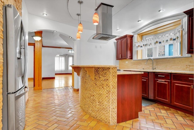 3016 N Major Ave, Chicago, IL 60634 - kitchen featuring a sink, island exhaust hood, stainless steel fridge with ice dispenser, arched walkways, and reddish brown cabinets