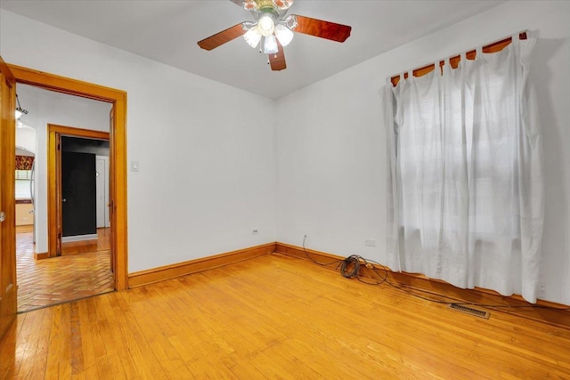 3016 N Major Ave, Chicago, IL 60634 - empty room with visible vents, light wood-style flooring, baseboards, and ceiling fan