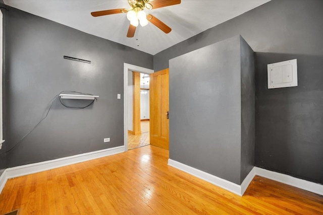 3016 N Major Ave, Chicago, IL 60634 - spare room with wood finished floors, baseboards, and ceiling fan