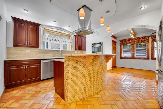 3016 N Major Ave, Chicago, IL 60634 - kitchen featuring arched walkways, stainless steel appliances, brick floor, and decorative light fixtures