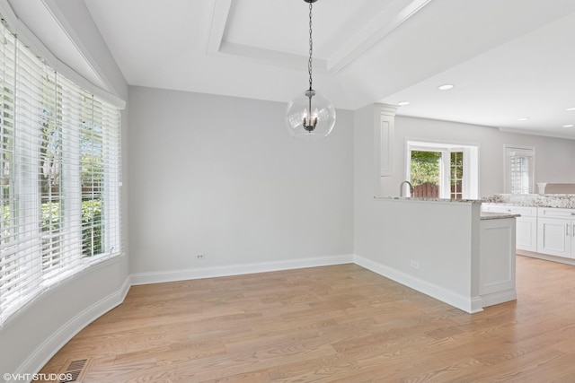 unfurnished dining area with light wood-style flooring, baseboards, recessed lighting, and a chandelier