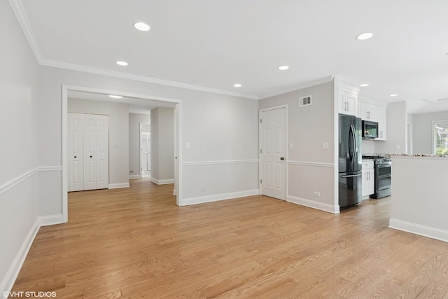 unfurnished living room with recessed lighting, light wood-style floors, crown molding, and baseboards
