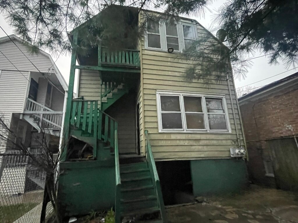 back of property with stairway