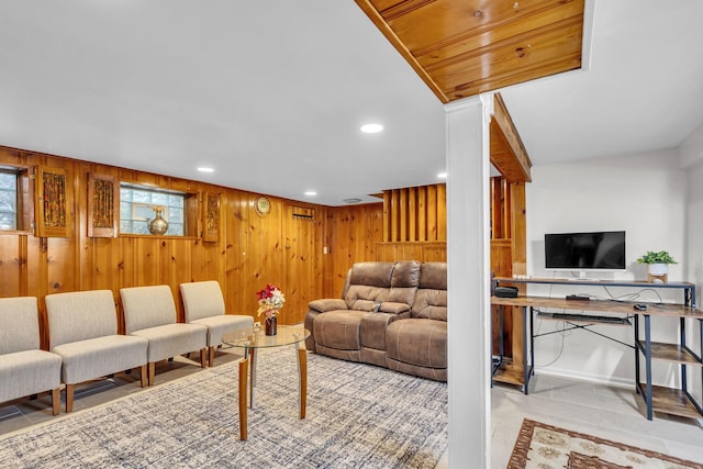 living room with wooden walls, recessed lighting, and tile patterned flooring
