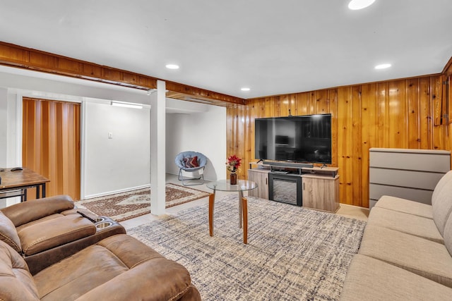living area with wooden walls and recessed lighting