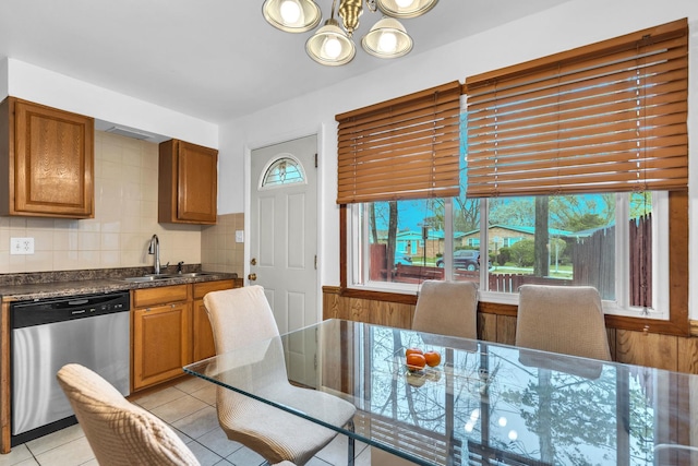 dining room with light tile patterned floors and a chandelier