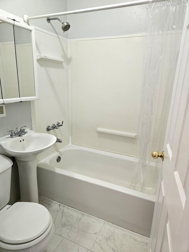 bathroom with toilet, shower / bathtub combination with curtain, and marble finish floor