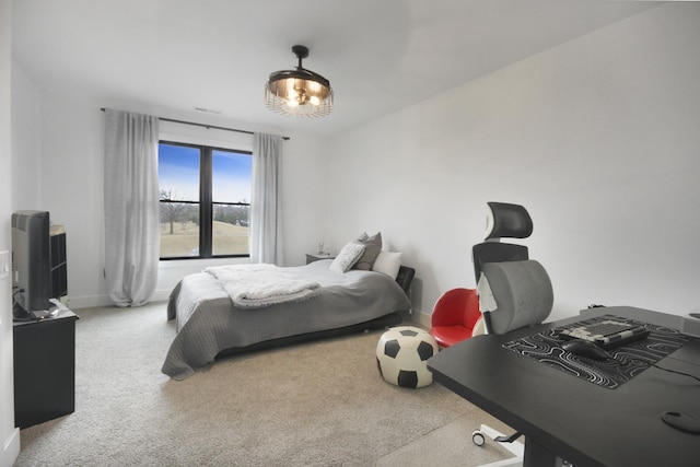 bedroom featuring carpet floors and baseboards