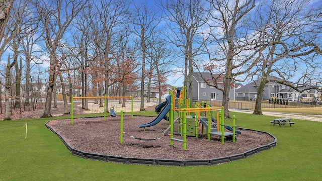 community playground with fence and a residential view