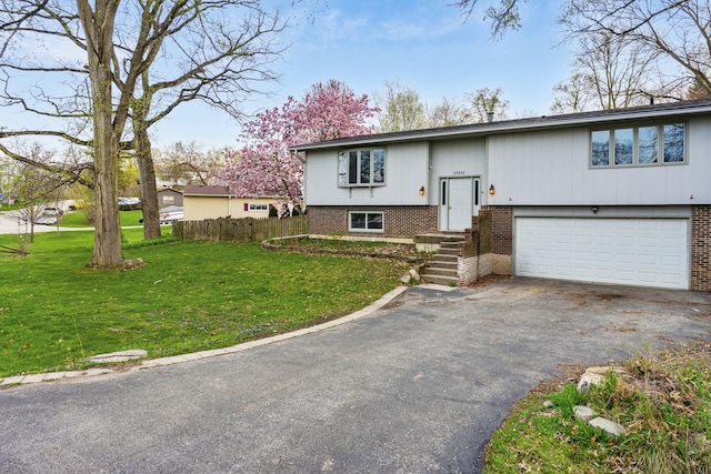 39540 N Channel View Dr, Antioch, IL 60002 - bi-level home featuring asphalt driveway, brick siding, and an attached garage