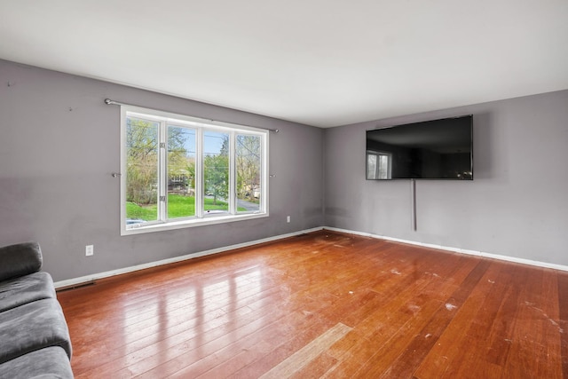 39540 N Channel View Dr, Antioch, IL 60002 - unfurnished living room with wood-type flooring and baseboards