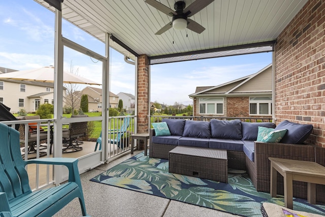 sunroom featuring an outdoor living space and ceiling fan