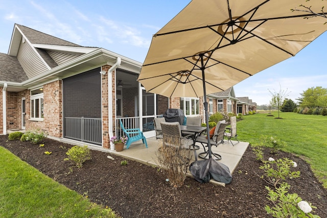 view of patio with a sunroom