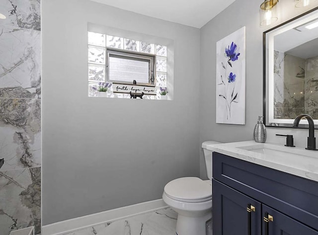 full bathroom featuring baseboards, vanity, toilet, marble finish floor, and a marble finish shower