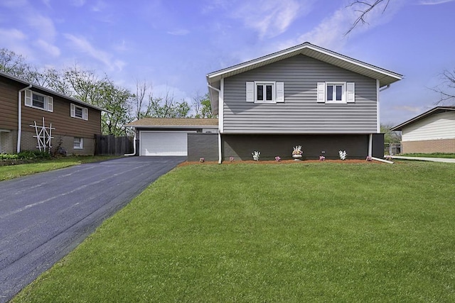 split level home featuring a garage and a front yard