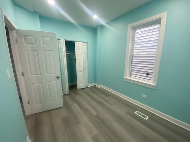 4826 S Throop St, Chicago, IL 60609 - unfurnished bedroom featuring baseboards, wood finished floors, a closet, and recessed lighting