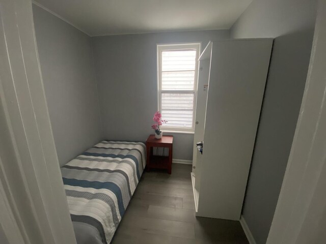 4826 S Throop St, Chicago, IL 60609 - bedroom featuring baseboards and wood finished floors