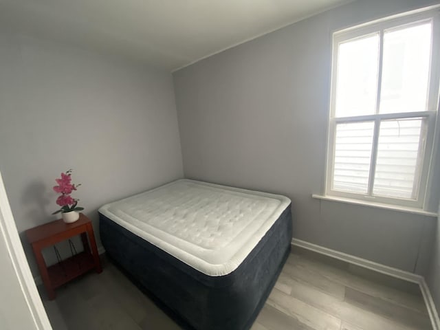 4826 S Throop St, Chicago, IL 60609 - bedroom with light wood-style floors and baseboards