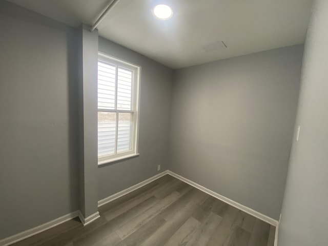4826 S Throop St, Chicago, IL 60609 - empty room featuring dark wood finished floors and baseboards
