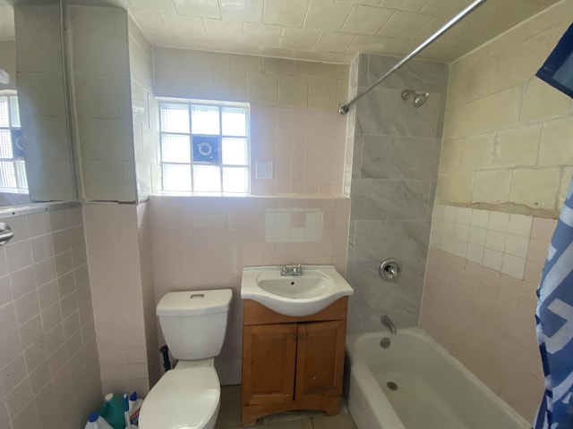 4826 S Throop St, Chicago, IL 60609 - bathroom with tile walls, shower / bathtub combination with curtain, toilet, and vanity