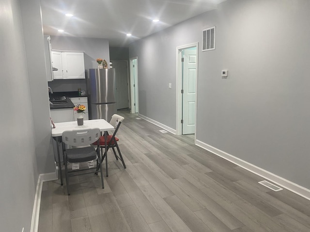 4826 S Throop St, Chicago, IL 60609 - dining space with light wood-type flooring, baseboards, and recessed lighting