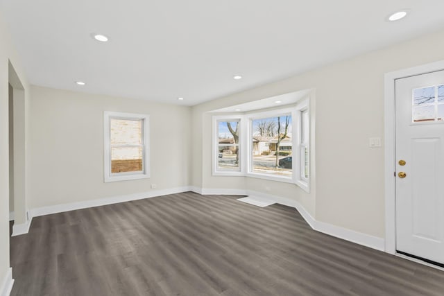 entrance foyer with recessed lighting, baseboards, and dark wood-style floors