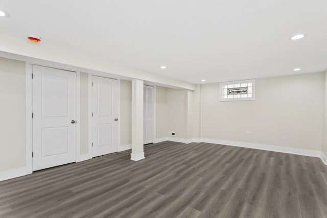 basement featuring baseboards, recessed lighting, and wood finished floors