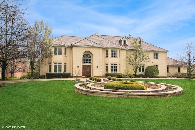 16 Forest Ln, South Barrington, IL 60010 - view of front of house featuring a front yard, a tiled roof, and brick siding