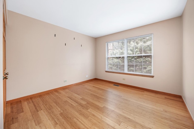 2218 Seaver Ln Unit 2218, Hoffman Estates, IL 60169 - unfurnished room featuring baseboards, light wood-type flooring, and visible vents