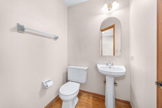 2218 Seaver Ln Unit 2218, Hoffman Estates, IL 60169 - bathroom featuring a sink, baseboards, toilet, and wood finished floors